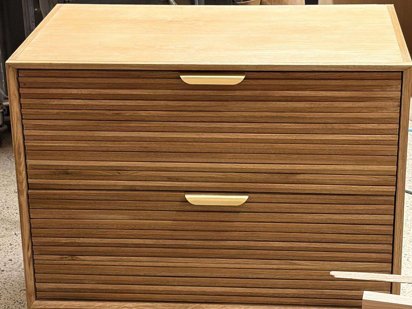 White oak two-drawer night stand with horizontal slatted fronts